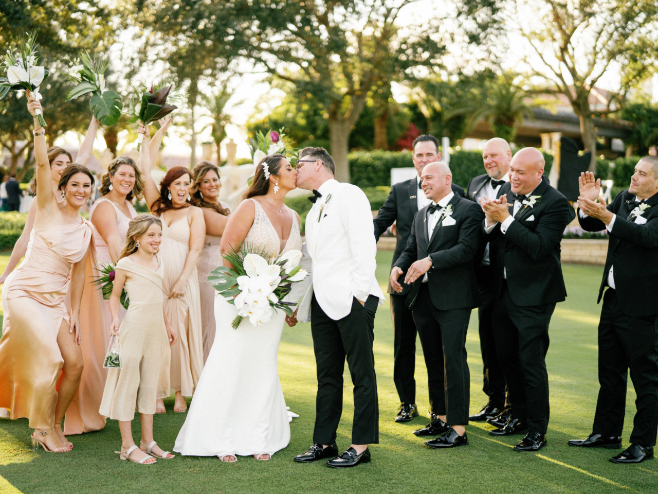 bridesmaids in gold dresses and groomsmen in black suits
