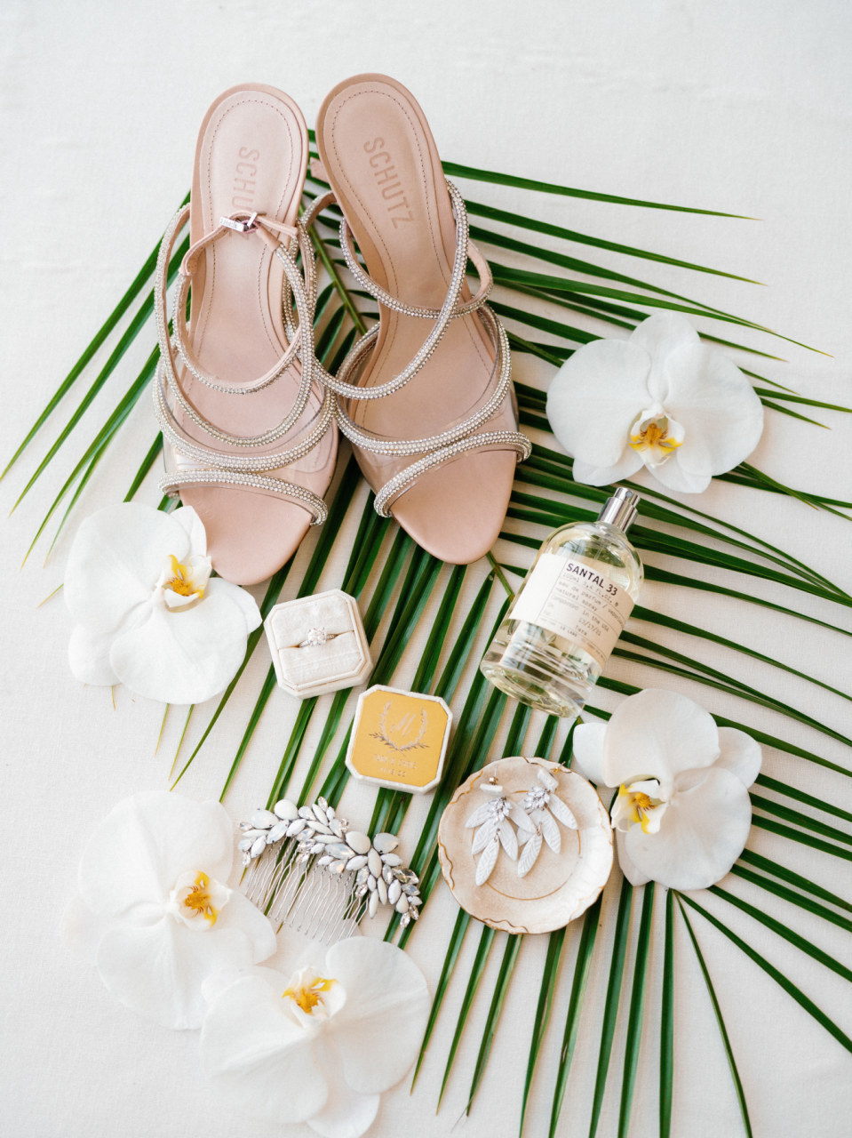 bridal accessories flatlay with tropical florals