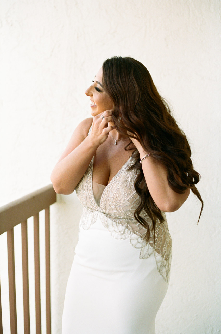 bride in white satin gown with gold bodice