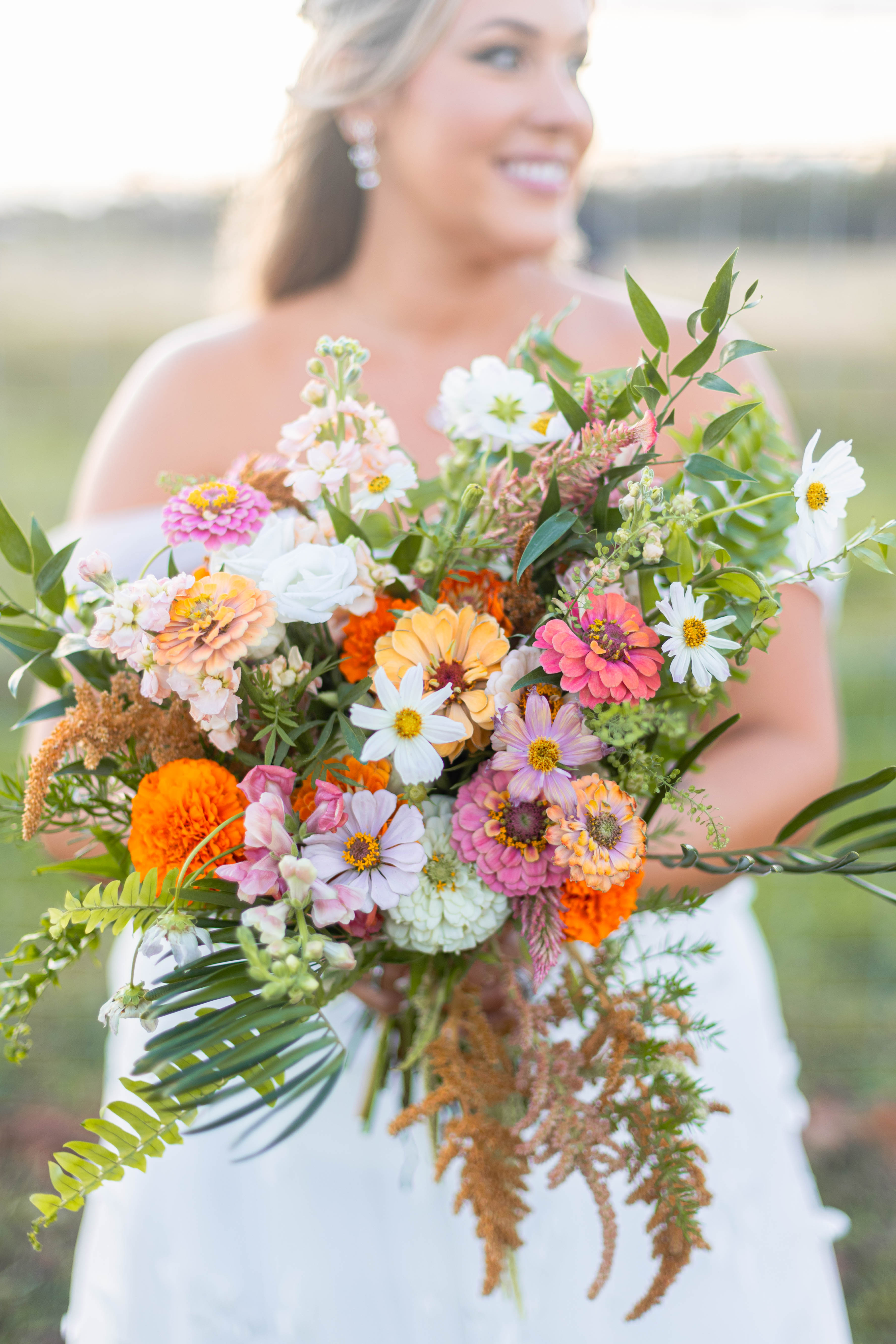 bride with colorful wildflower bouquet 