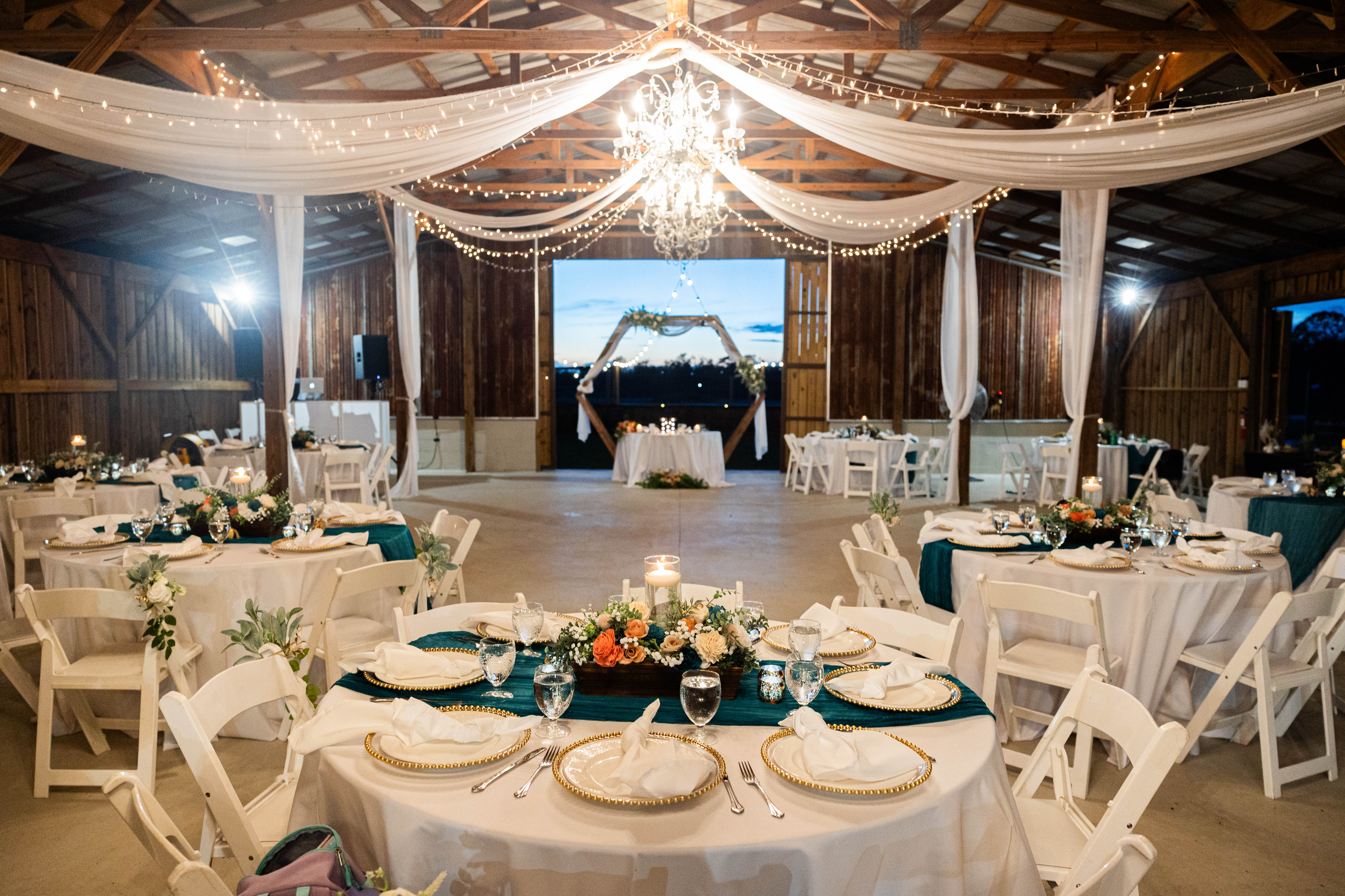 elegant barn lighting for wedding reception