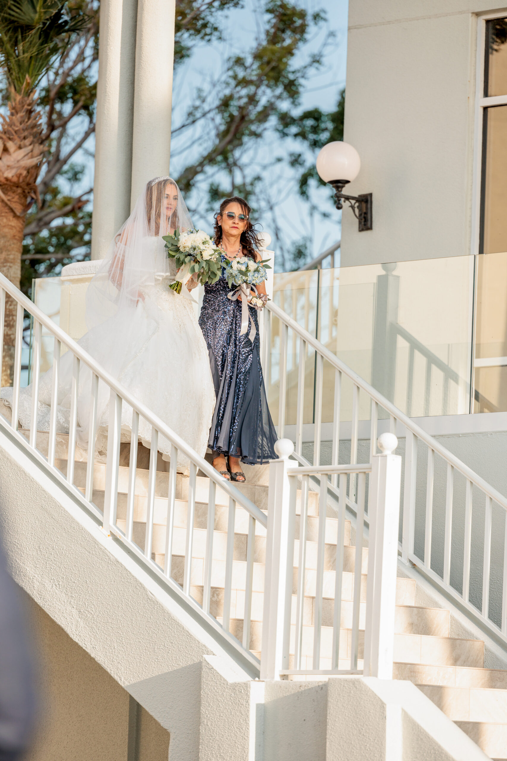 mother walking bride down aisle at Marriott Sanibel Harbour Resort and Spa