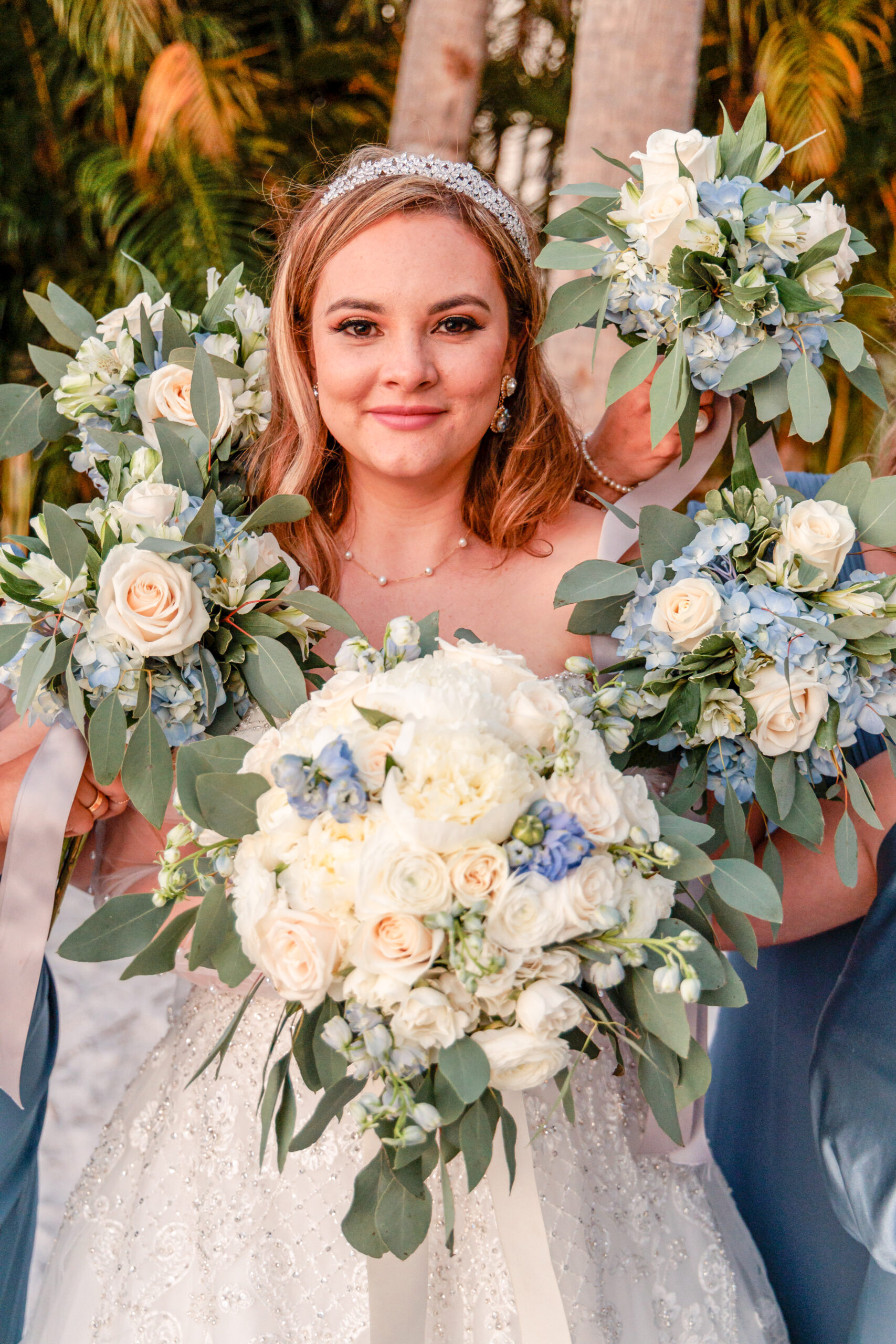 bride surrounded by bridesmaids white bouquets