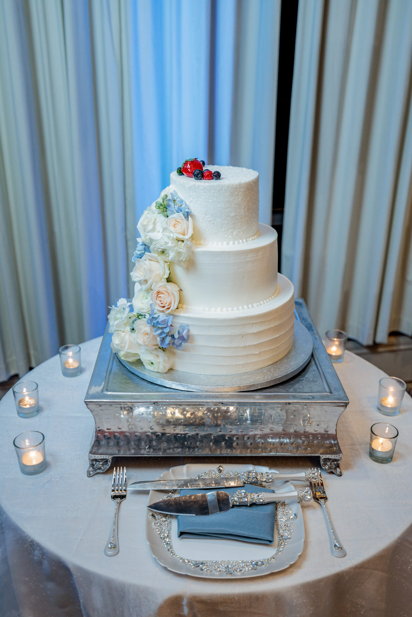 white wedding cake with colorful floral accents