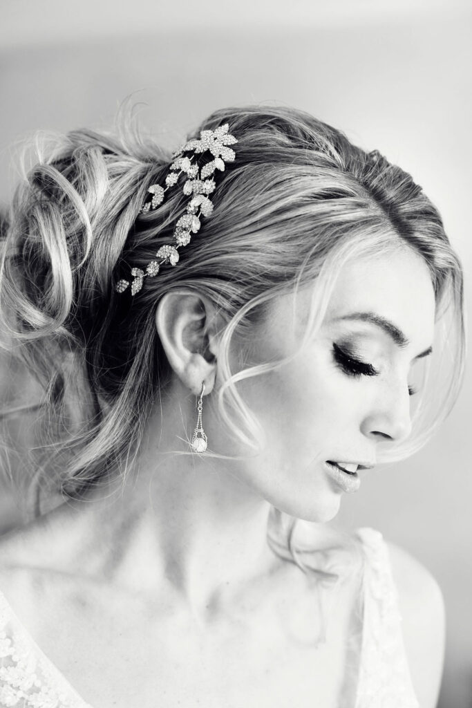 bride with classic updo and floral jewel hairpiece