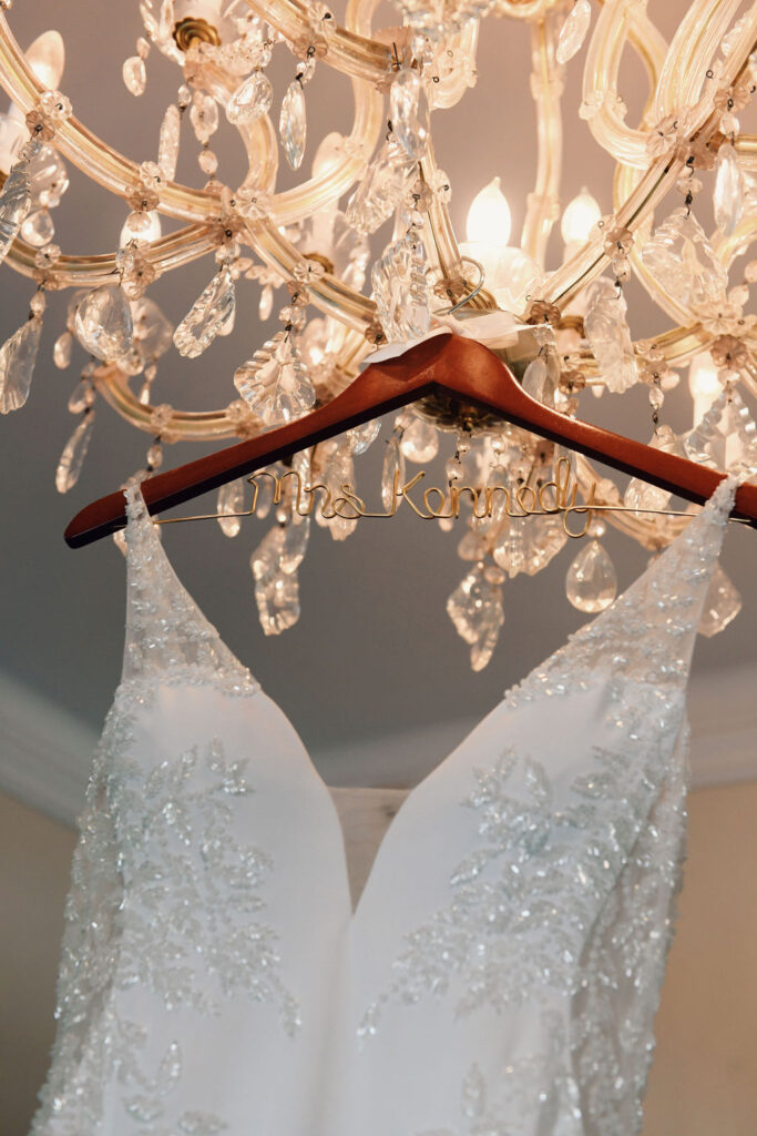 embroidered wedding gown on custom hanger