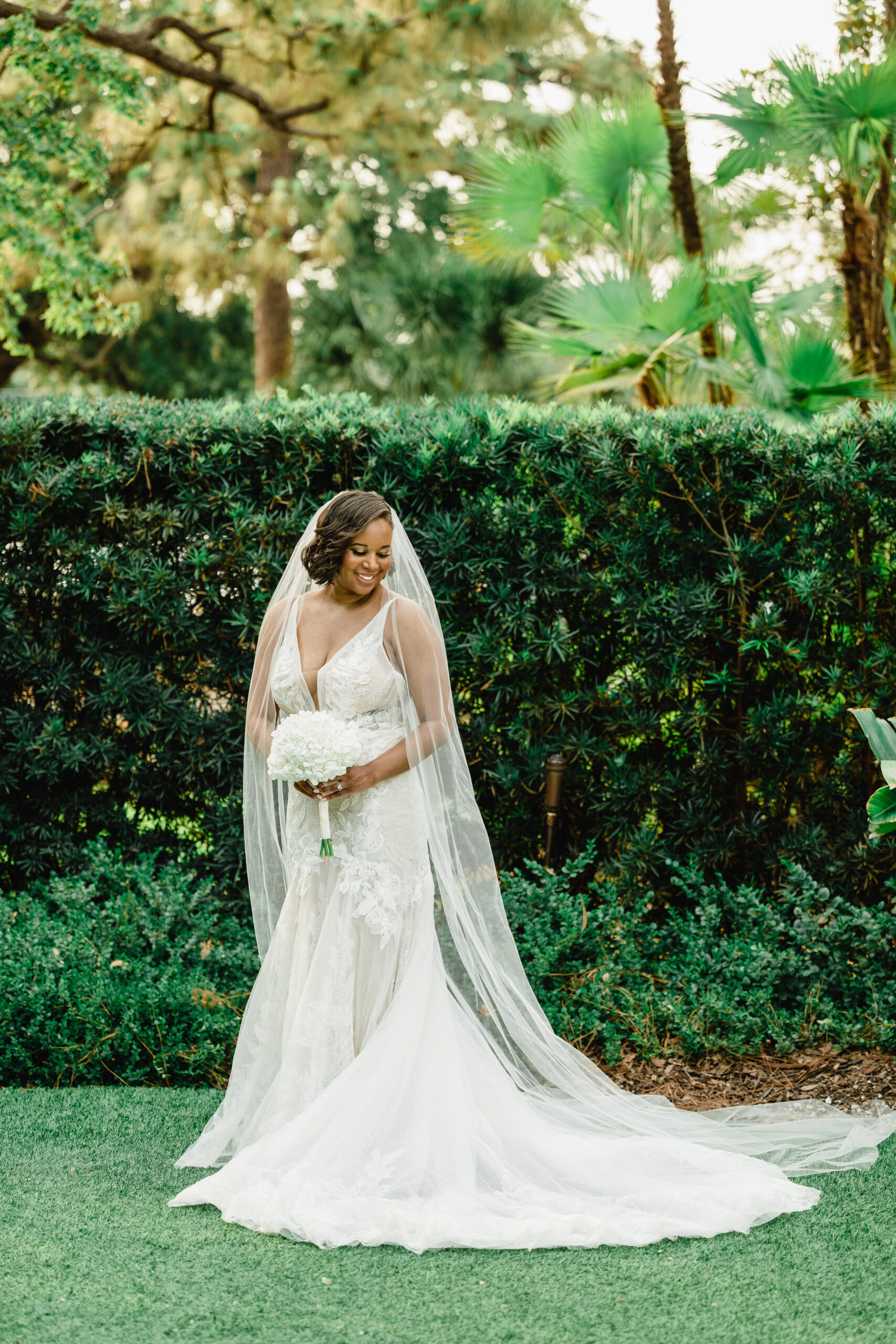 bride in embroidered lace gown with cathedral veil
