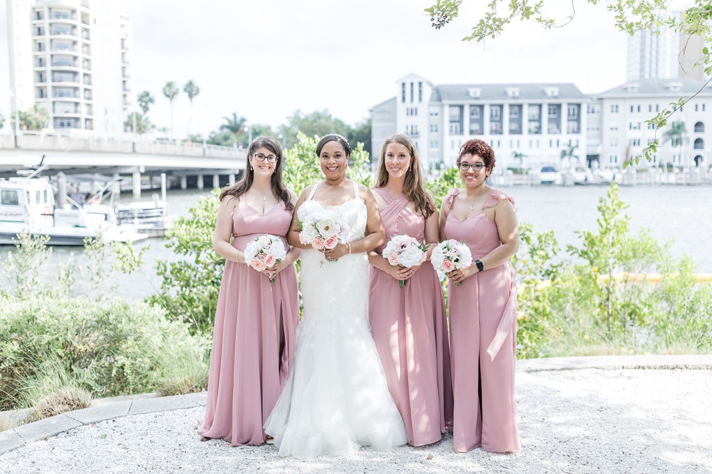 bridesmaids in mismatched pink dresses